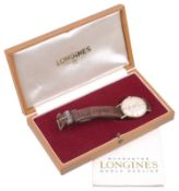 A 9ct gold Longines gentlemans watch, with brown leather strap