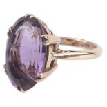 A large Continental amethyst set dress ring