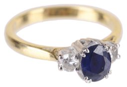 A delicate sapphire and diamond three stone ring