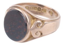 A rose gold and bloodstone set gentleman's signet ring
