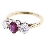 A good three stone ruby and diamond set ring