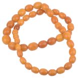 A graduated amber bead necklace