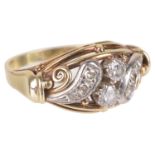 An attractive Continental, Edwardian style diamond set scroll ring