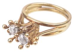 A Contemporary two stone diamond set random cluster ring