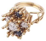 A contemporary Continental diamond and sapphire abstract floral ring