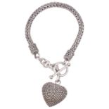 A heavy Balinese Suarti white metal woven bracelet with heart pendant