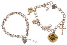 A delicate yellow metal charm bracelet and another(2)