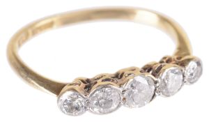 An early 20th c. five stone diamond set half hoop ring