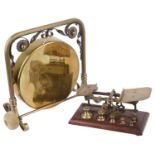 A brass and copper table gong, and brass and mahogany postal scales(9)