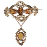 A large Victorian citrine set pendant scroll brooch