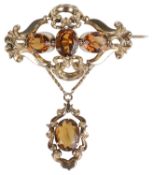 A large Victorian citrine set pendant scroll brooch