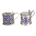 Two Victorian silver mustard pots, with blue glass liners