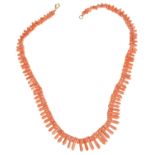 An attractive carved coral Egyptian revival style collar necklace