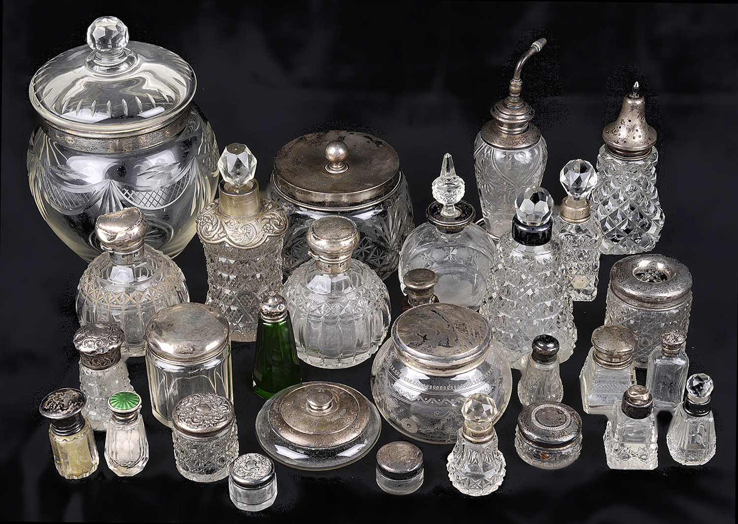 A collection of Victorian & later silver collared & topped scent bottles, cruet bottles & power jars