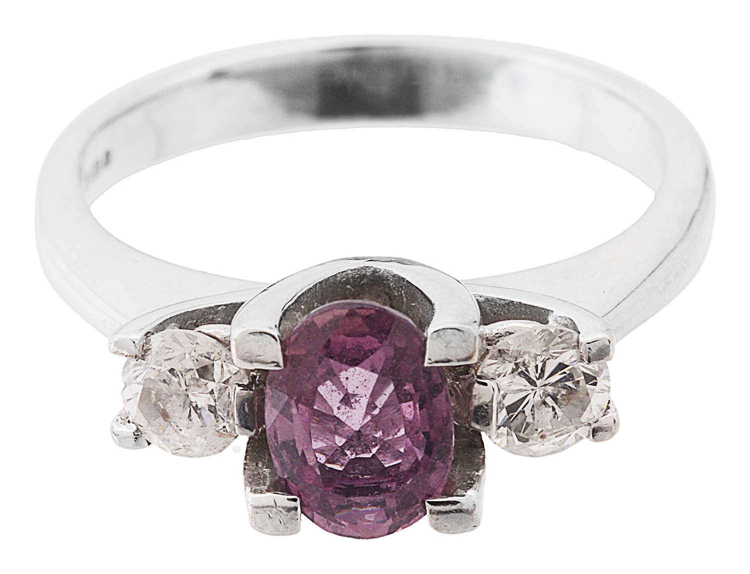 A contemporary diamond and ruby three stone ring