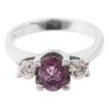 A contemporary diamond and ruby three stone ring