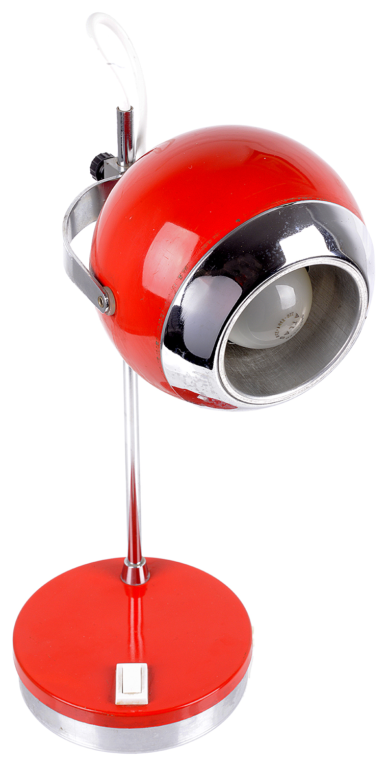 A retro 1970s red and chrome desk lamp