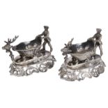 An unusual pair of Continental white metal figural sleigh salts