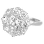 A large Edwardian circular diamond set cluster ring