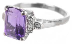 A rectangular cut amethyst and diamond set ring