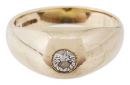 A gold mounted single stone diamond set gypsy ring