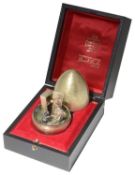 Stuart Leslie Devlin silver-gilt "Old Mother Hubbard Nursery Rhyme Egg", hallmarked London 1983