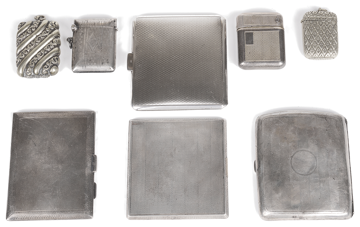 A collection of Edwardian and later silver and silver plated cigarette cases and vesta cases