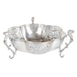 An Edwardian three handled lobed silver bowl, hallmarked Chester 1905