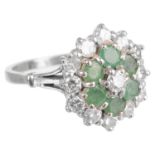 A Continental diamond and emerald cluster ring