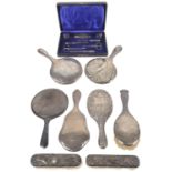 A collection of George V & later silver dressing table brushes, mirrors & cased silver manicure set