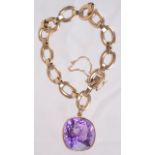 A gold link bracelet with large amethyst pendant drop, approx. 30 carats