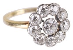 An attractive Edwardian diamond set open 'daisy' cluster ring