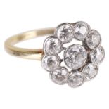 An attractive Edwardian diamond set open 'daisy' cluster ring