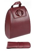 A Cartier burgundy leather backpack, with leather comb holder (2)