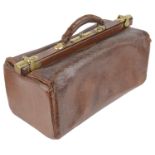 An early 20th century brown leather Gladstone bag