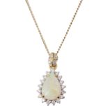 An attractive Continental tear shaped opal and diamond pendant