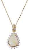 An attractive Continental tear shaped opal and diamond pendant