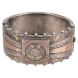 A Victorian silver and gold overlay hinged bangle