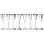 Stuart Leslie Devlin set of eight parceil-gilt silver champagne flutes, hallmarked London 1977