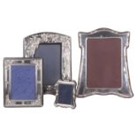 A collection of four contemporary silver photo frames