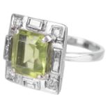 An Art Deco style perridot and diamond set ring