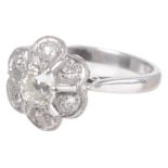 A Continental old cut diamond set cluster ring