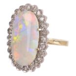 An attractive Continental precious opal and diamond cluster ring