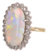 An attractive Continental precious opal and diamond cluster ring
