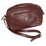 A Cartier burgundy leather messenger bag, with dust bag