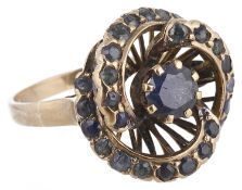 A sapphire set swirl dress ring