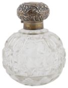 An Edwardian silver topped glass perfume bottle