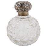 An Edwardian silver topped glass perfume bottle