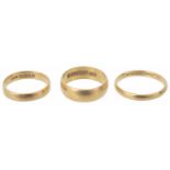 Three 22ct gold wedding bands of various sizes