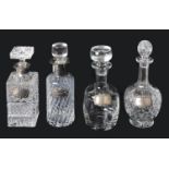 Four glass decanters with silver decanter labels, 20th century
